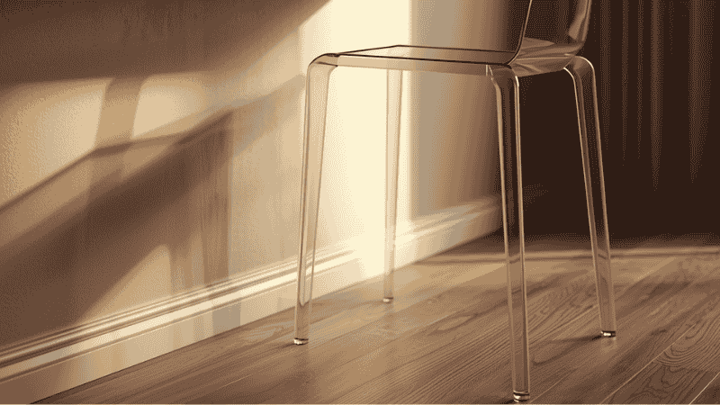 A close-up shot of the suspended oak office desk and the transparent ghost chair highlights the unobstructed flow of the ground line of sight. This is a typical design language for reducing visual obstruction in small spaces.